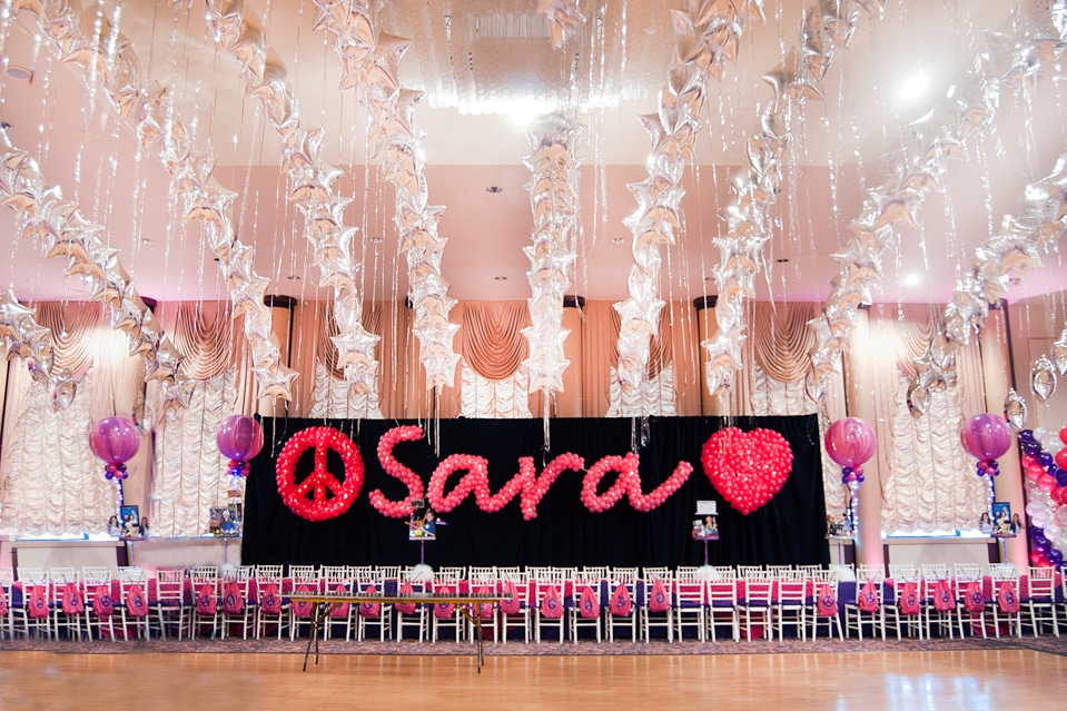 Hot Pink Name in Balloons with Peace Sign and Heart Sculpture on Curtain Backdrop