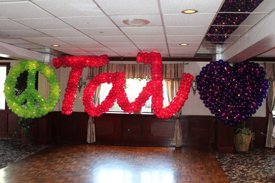 Peace Sign and Heart Balloon Sculpture with Name in Balloons and Lights