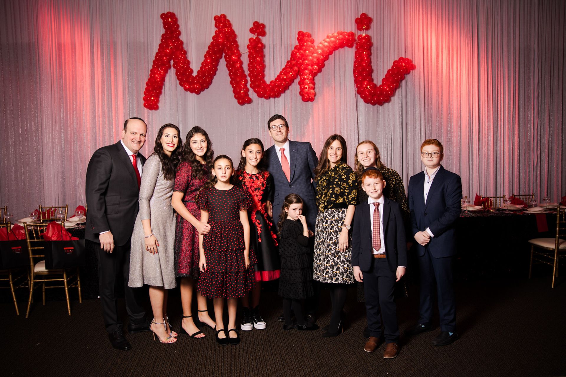 Red Name Balloon Sculpture with Lights on LED Curtain