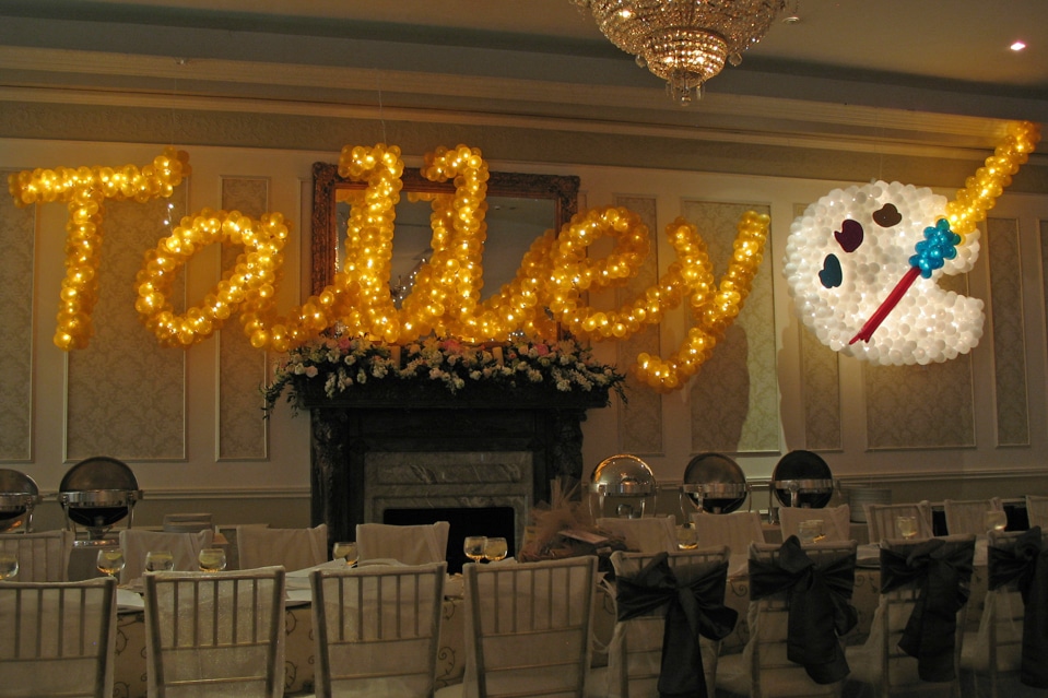 Gold Name in Balloons with Art Palette Sculpture and Lights