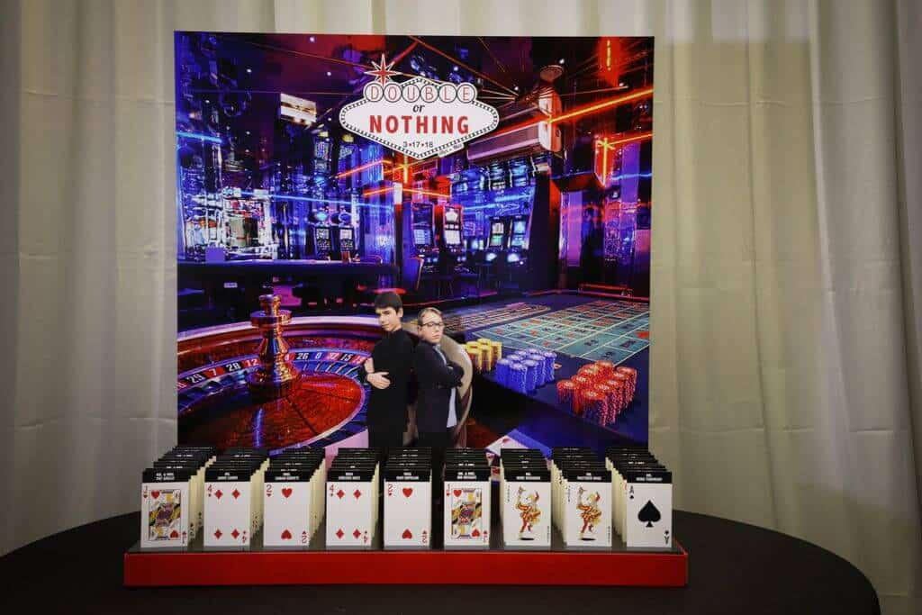 Casino Themed Seating Card Display with Vegas Background and Playing Card Place Cards