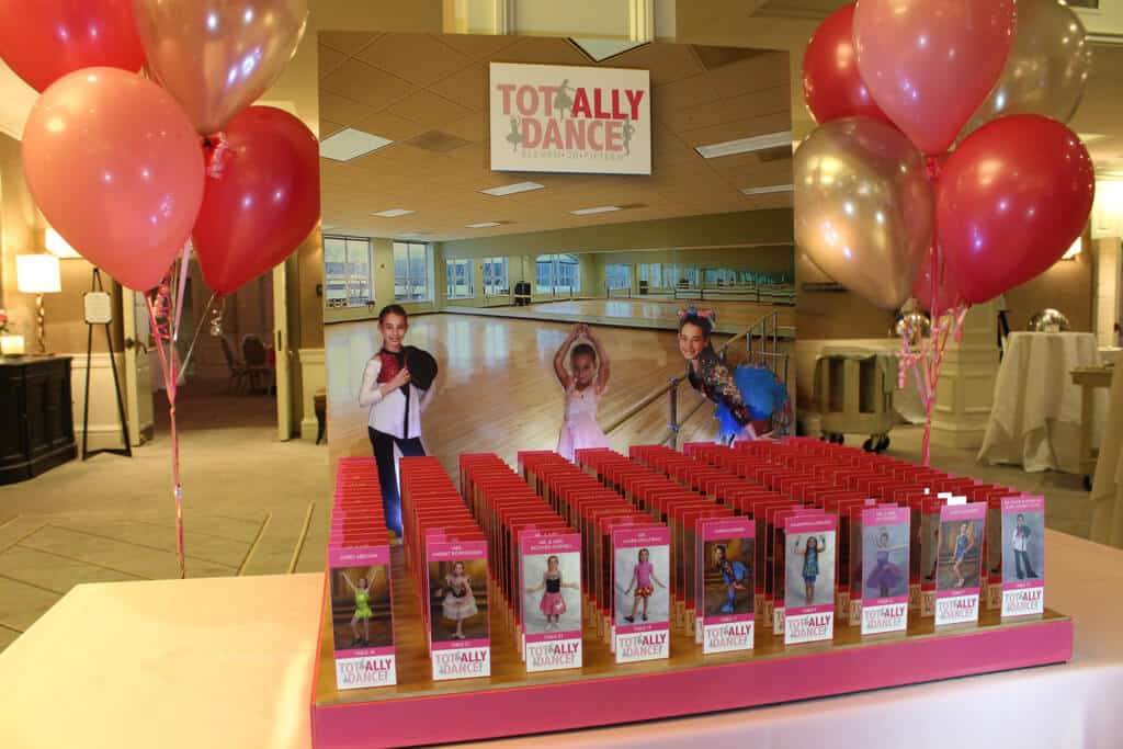 Dance Themed Seating Card Display with Studio Background and Cutout Photos