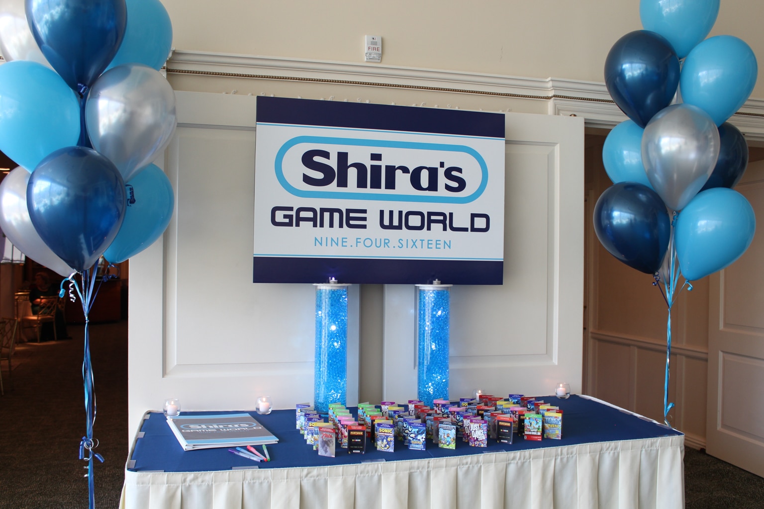 Video Game Themed Seating Card Display with Custom Logo