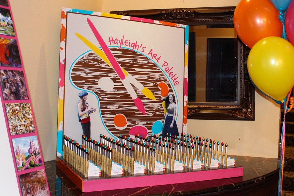 Art Themed Seating Card Display with Blowup Logo and Paintbrush Place Cards