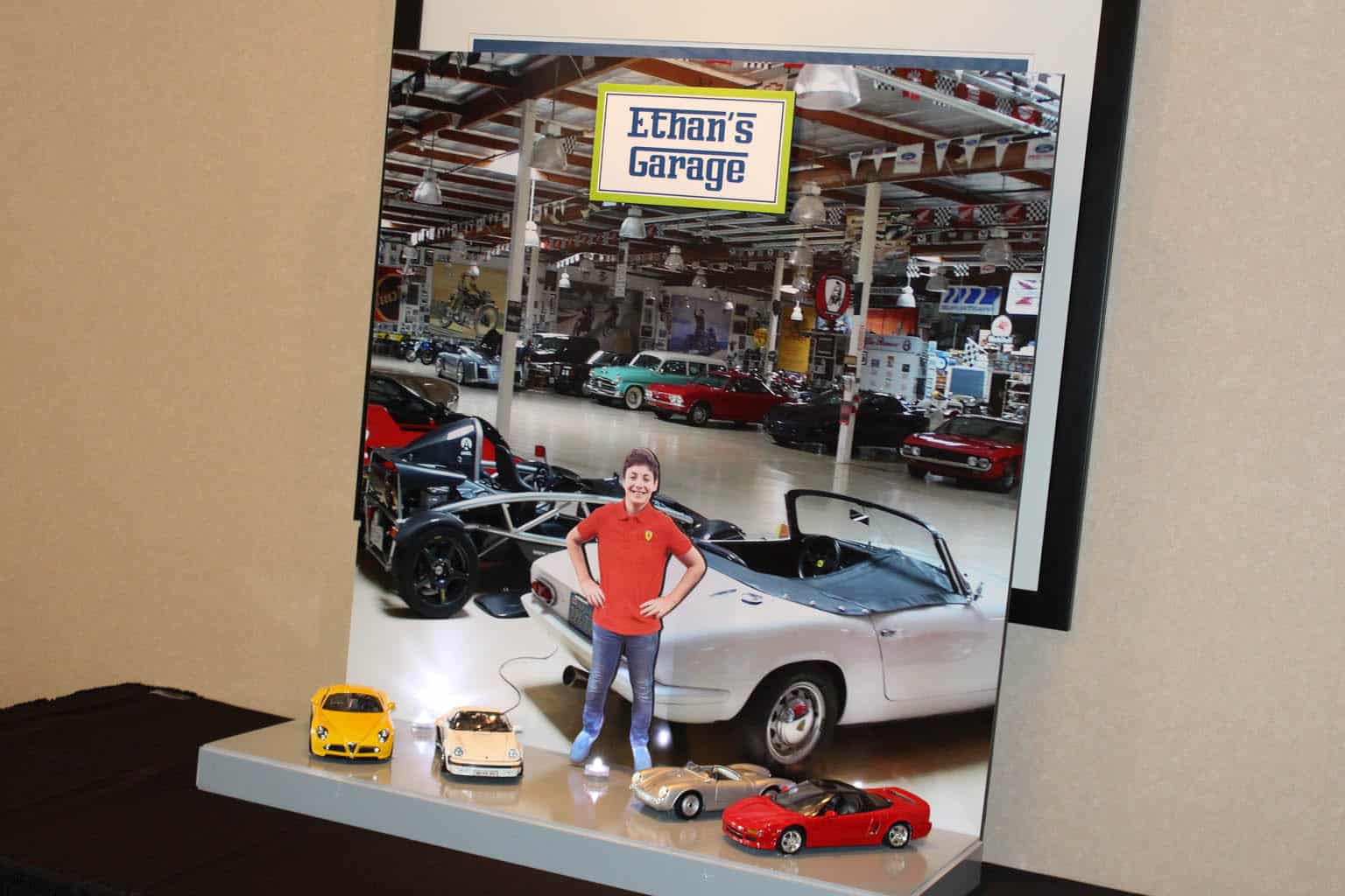 Car Themed Bar Mitzvah Display with Blowup Photo of Garage and Car Props