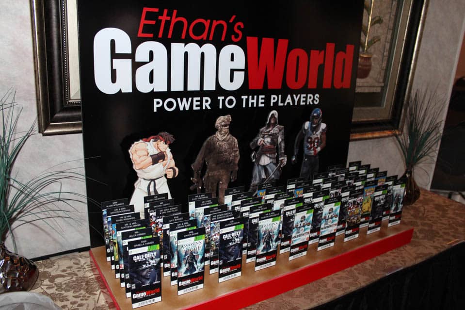 Video Game Themed Seating Card Display with Logo and Cutouts