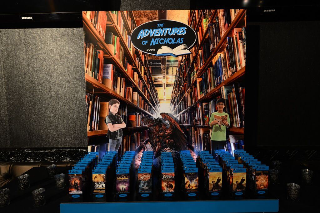 Book Themed Seating Card Display with Library Background and Bookmark Place Cards