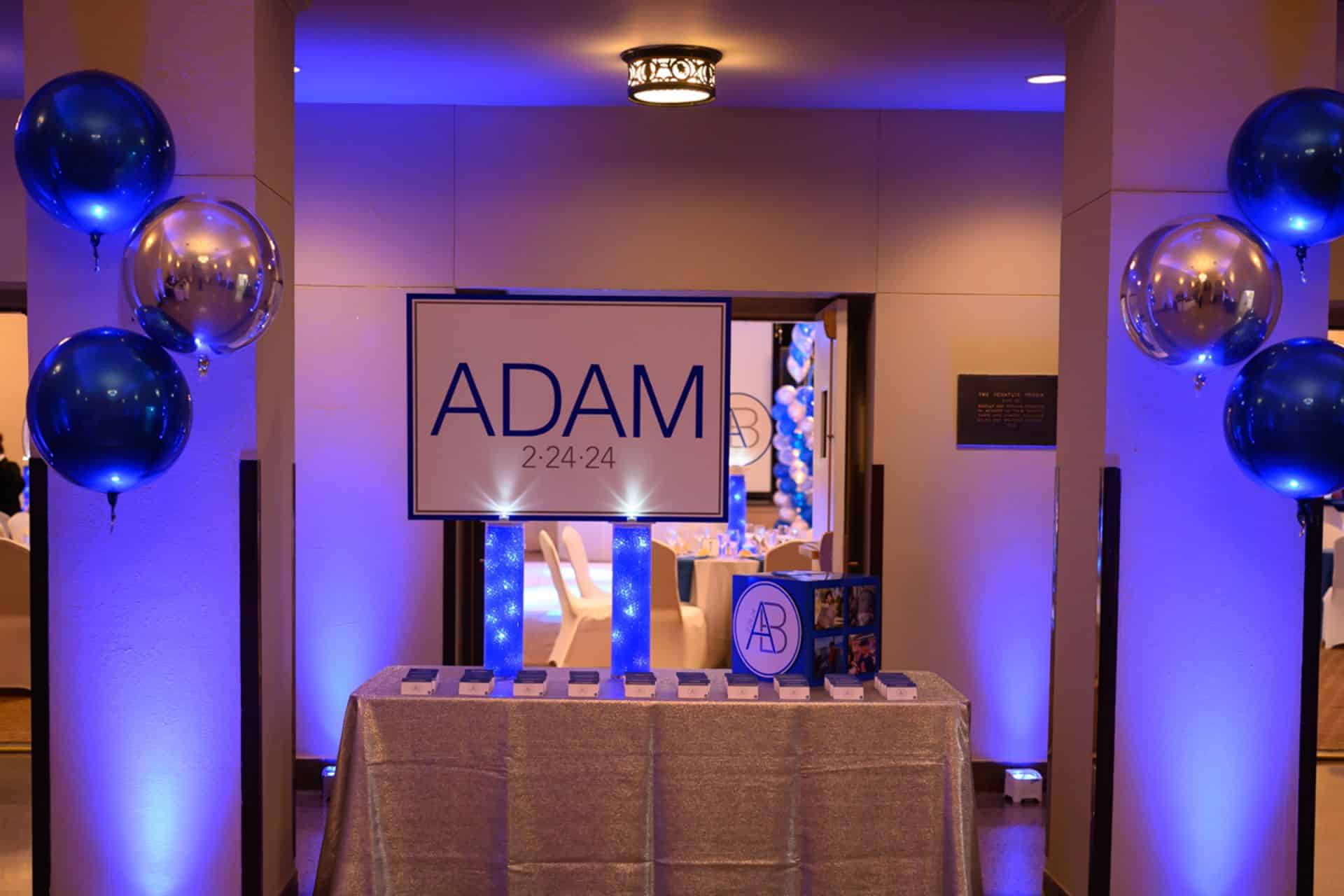 Entrance Decor with Custom Logo Display and Metallic Orbs