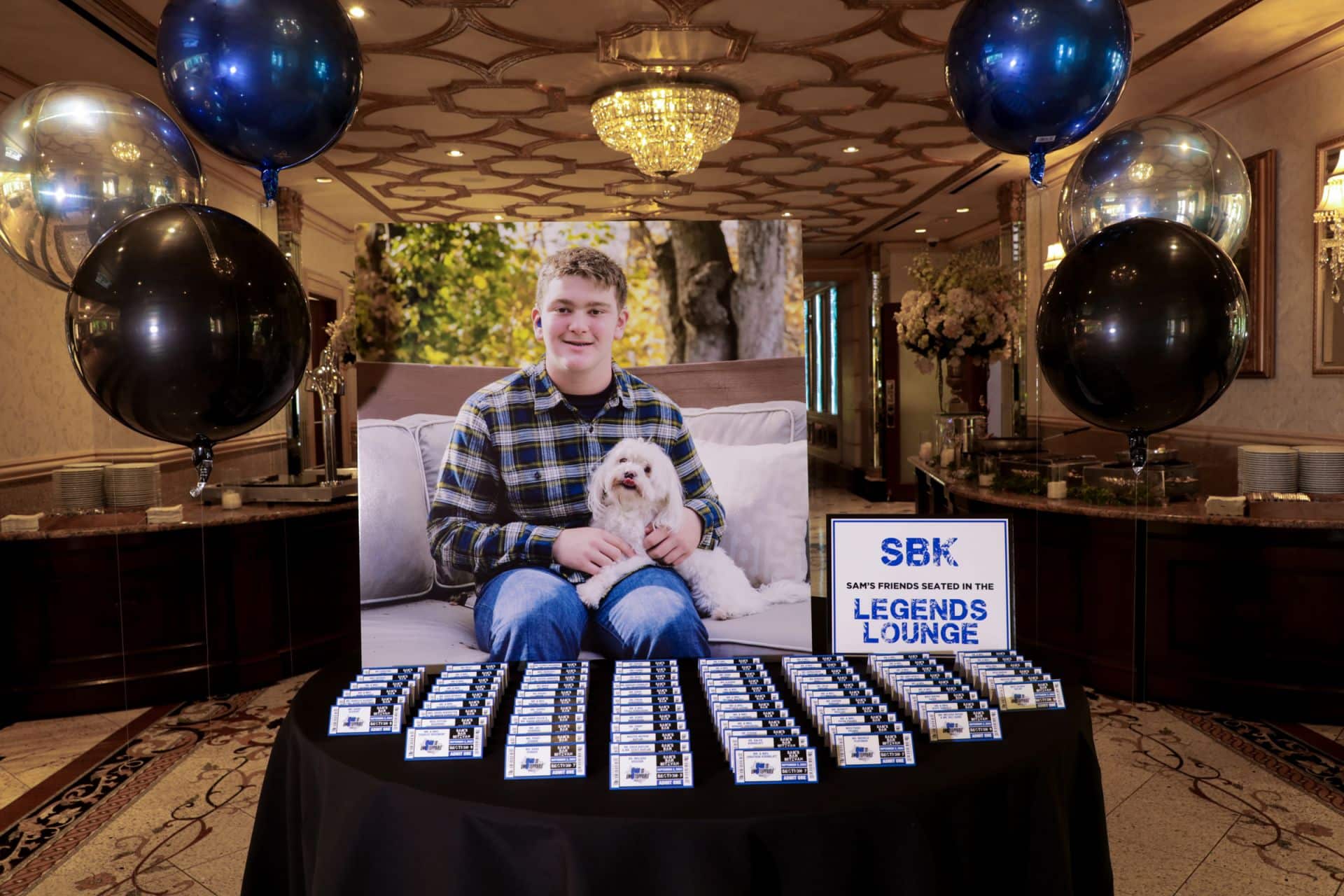 Bar Mitzvah Entrance Display with Blowup Photo and Custom Ticket Place Cards at Seasons