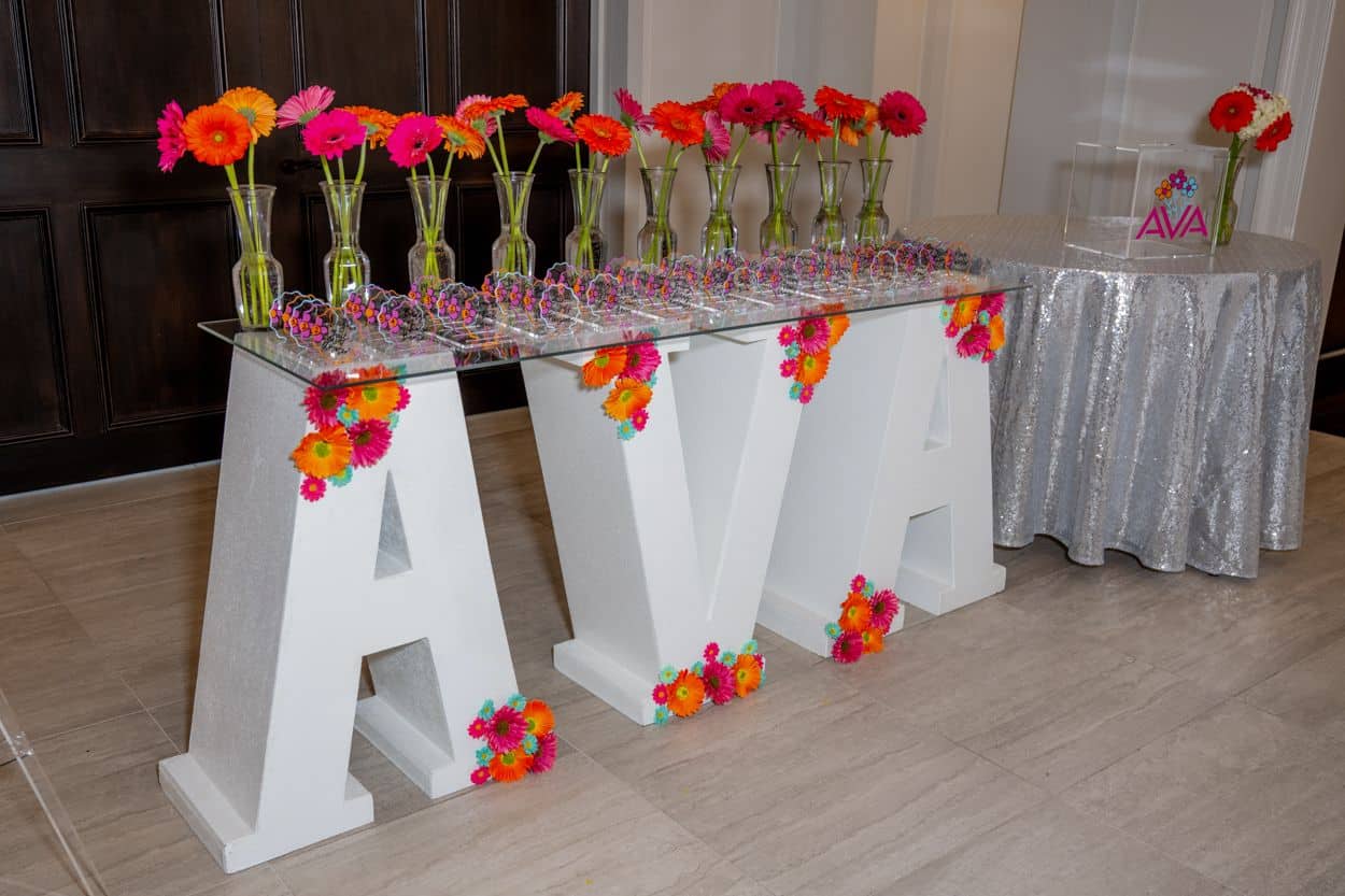 Seating Card Display with Marquee Letter and Gerber Daisy