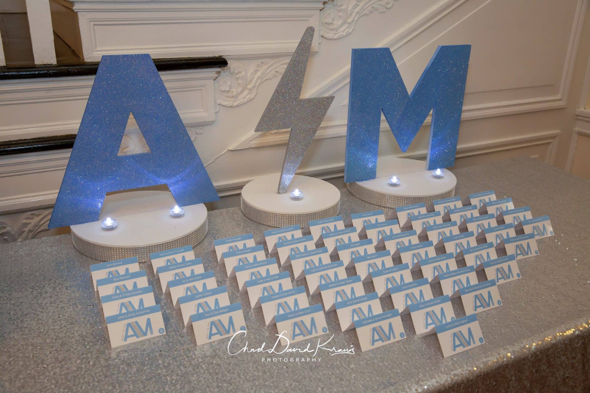 Blue Glitter Initials and Lightening Bolt Seating Card Display