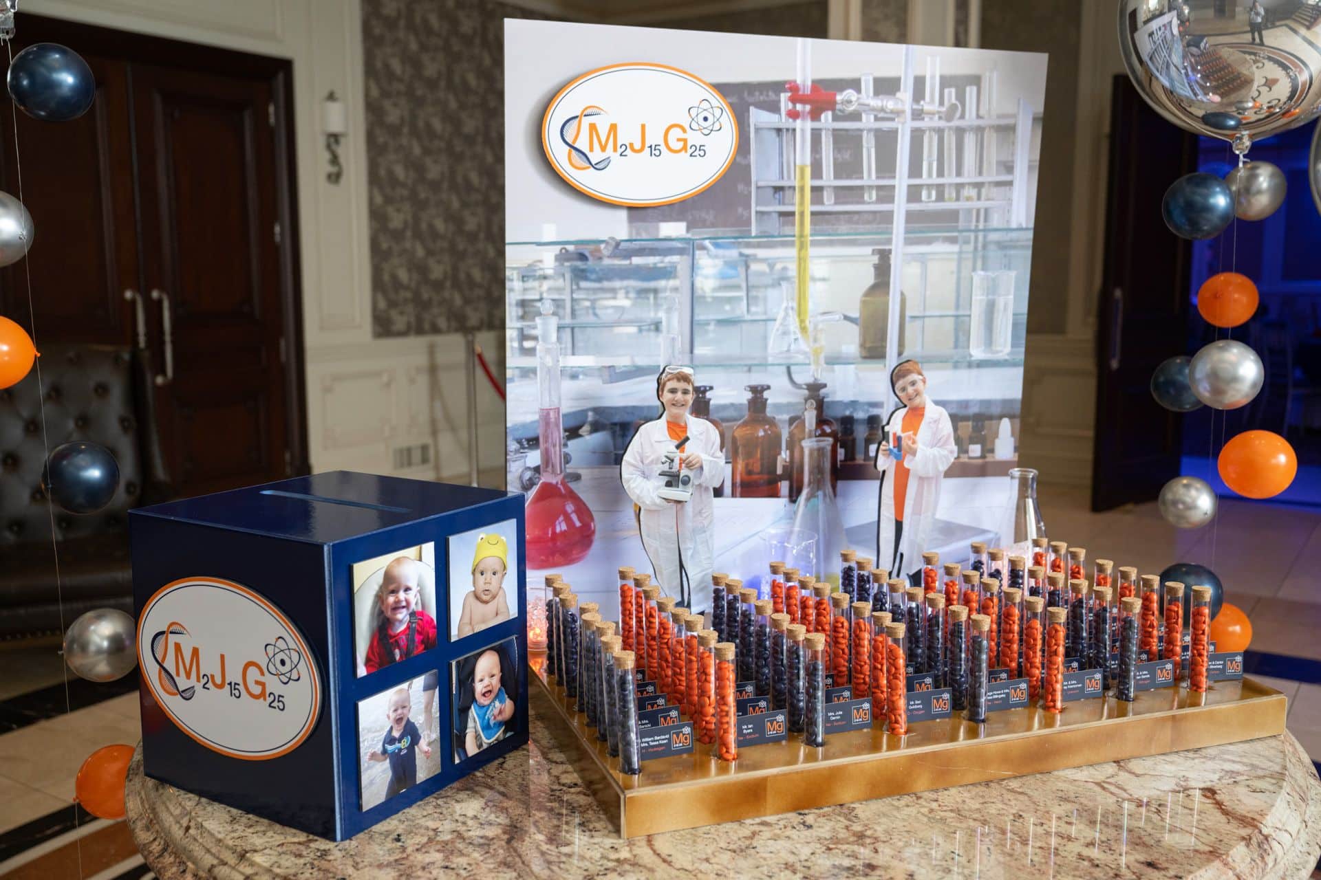 Science Theme Seating Display with Custom Fold Over Place Cards Next to Orbs with Bubble Balloons