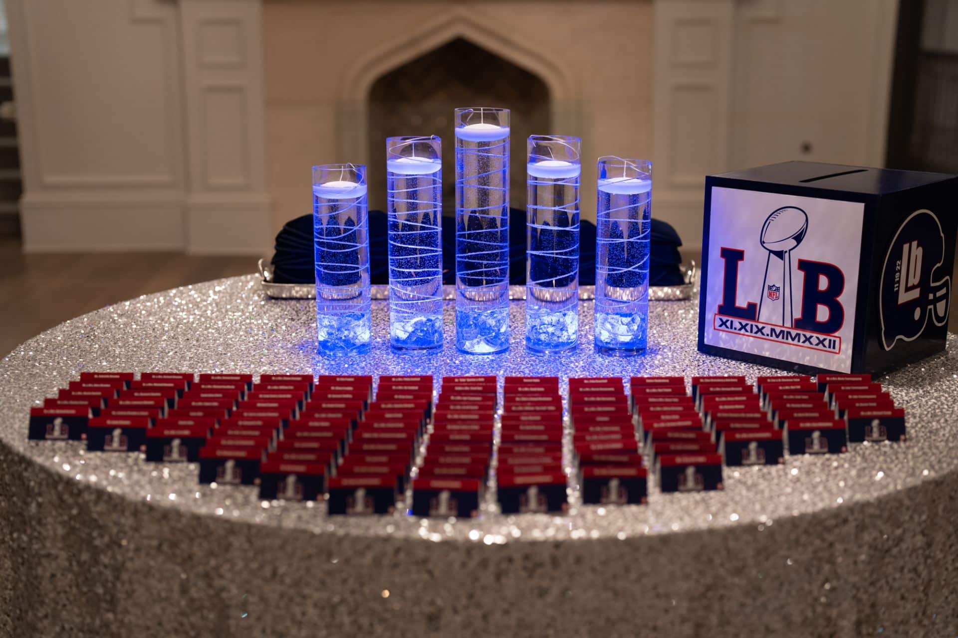 Giants Themed Entrance Table with LED Cylinders and Logo Place Cards