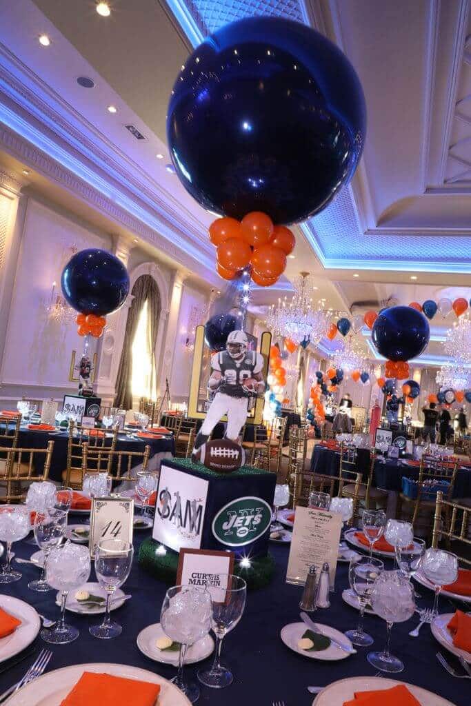 Jets Themed Centerpiece with Cutout Player and Navy and Orange Balloons