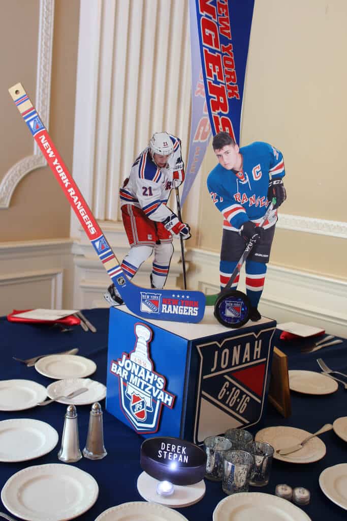 Rangers Themed Centerpiece with Photo Cutouts, Hockey Sticks and Pucks and Custom Logo