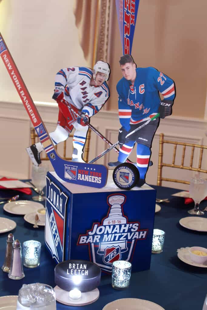 Rangers Themed Centerpiece with Photo Cutouts, Hockey Sticks and Pucks and Custom Logo