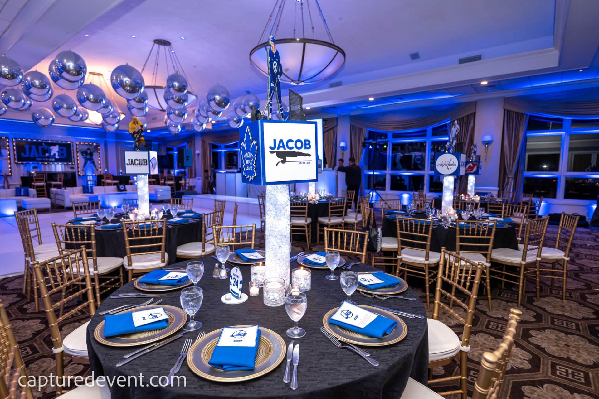 NHL Cube Centerpiece with Custom Logos and Player Cutouts on LED Vases at Cedar Hill Country Club