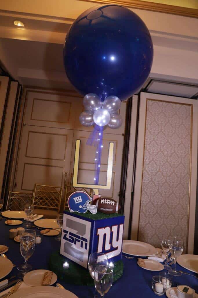 Football Themed Centerpiece with Custom Logo and Sports Equipment