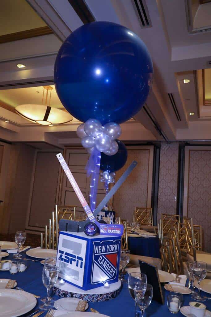 Hockey Themed Centerpiece with Custom Logo and Sports Equipment