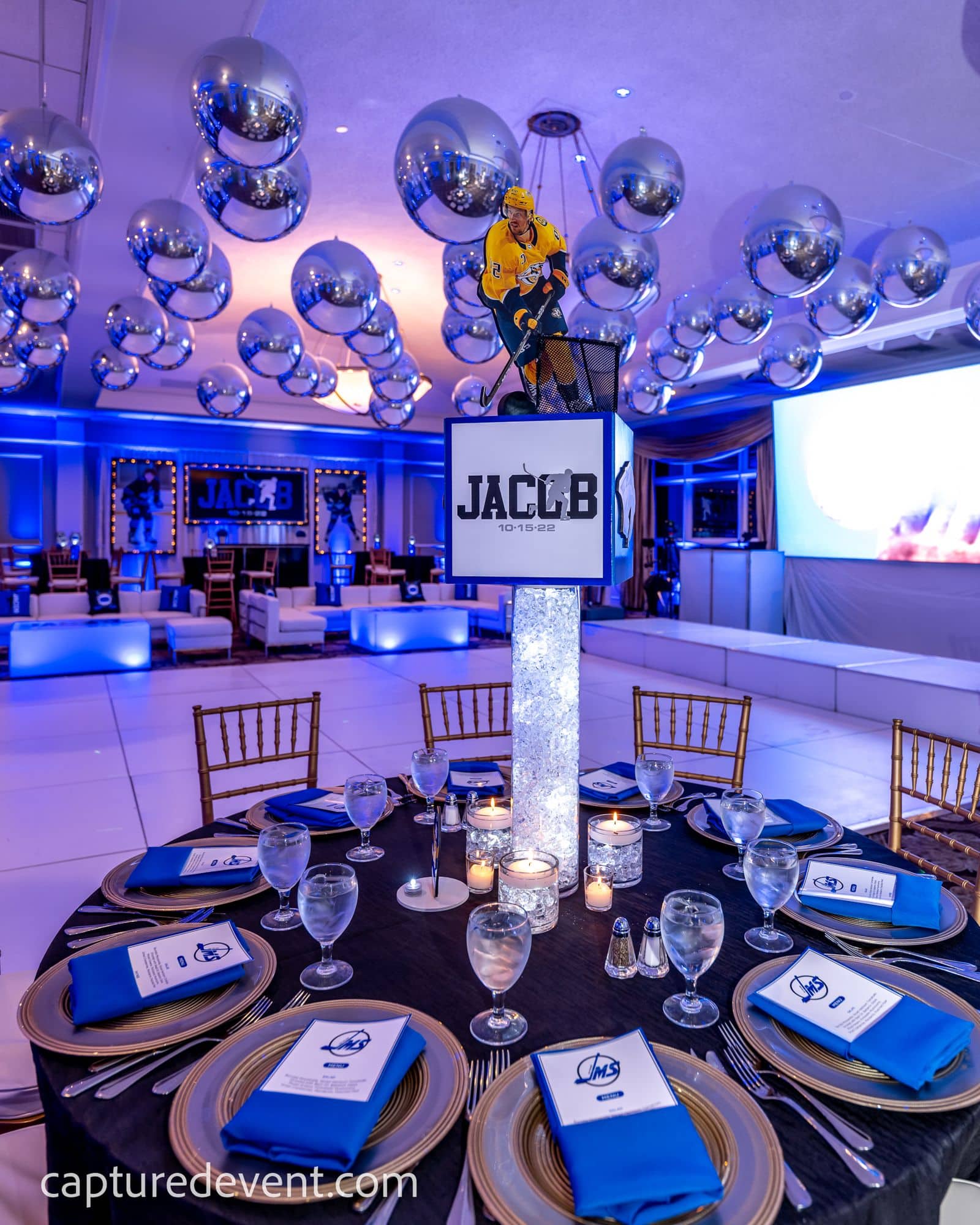 NHL Cube Centerpiece with Custom Logos and Player Cutouts on LED Vases at Cedar Hill Country Club