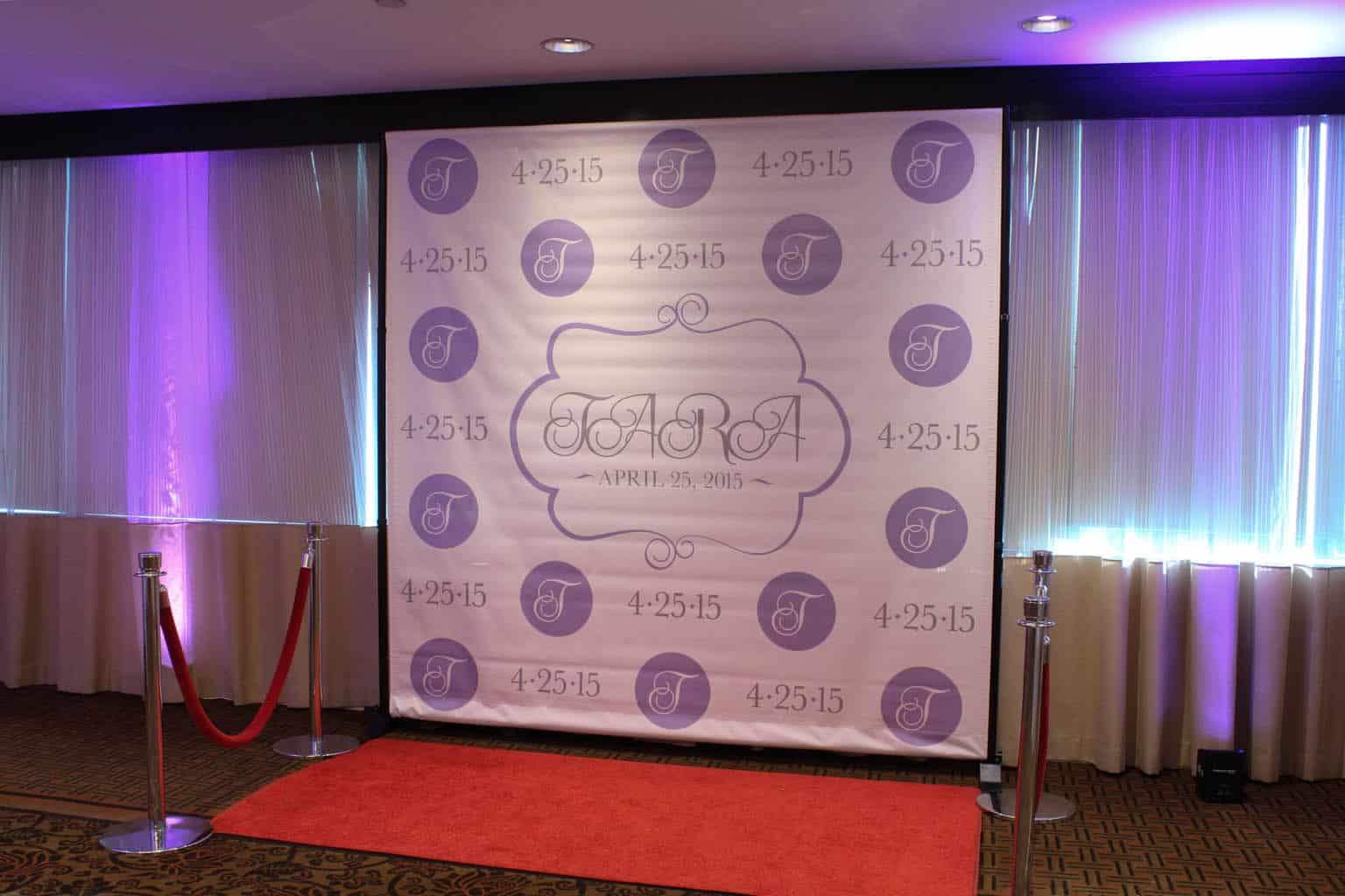 Sweet Sixteen Step and Repeat Setup with Red Carpet and Stanchions