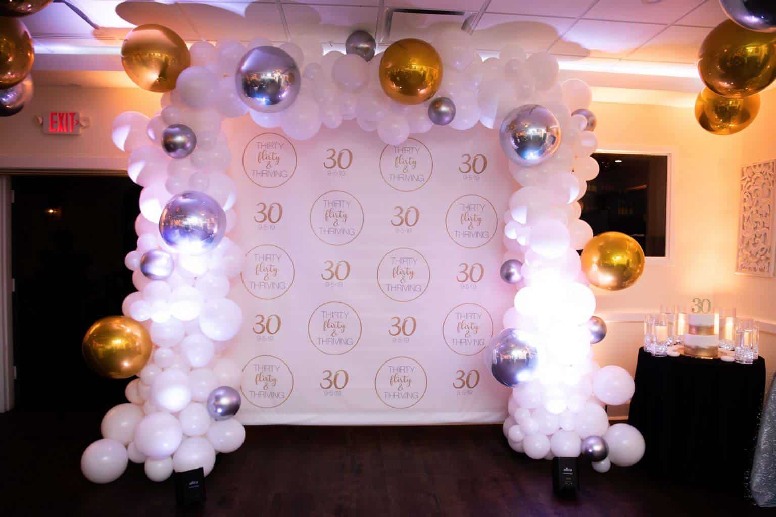 30th Birthday Step and Repeat Display with Gold, White and Silver Organic Balloon Arch