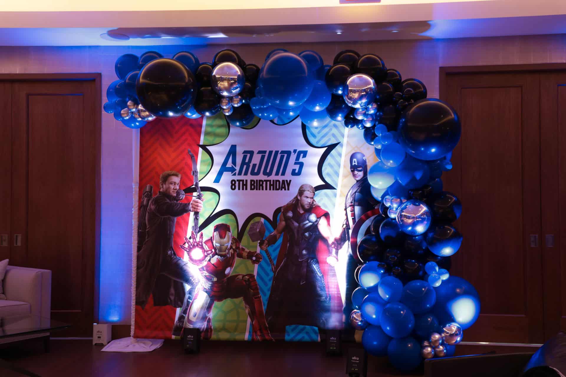 Custom Marvel Themed Photo Backdrop with Blue and Black Balloon Garland