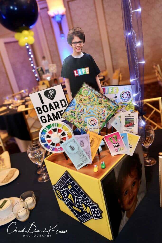 Life Themed Centerpiece with Custom Cutouts and Game Pieces for Game Themed Bar Mitzvah