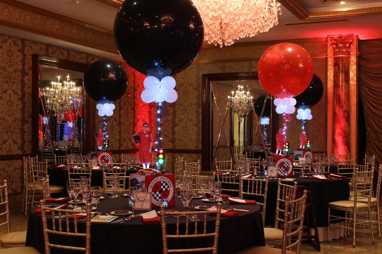 Car Themed Centerpieces with Alternating Black and Red Balloons and Lights
