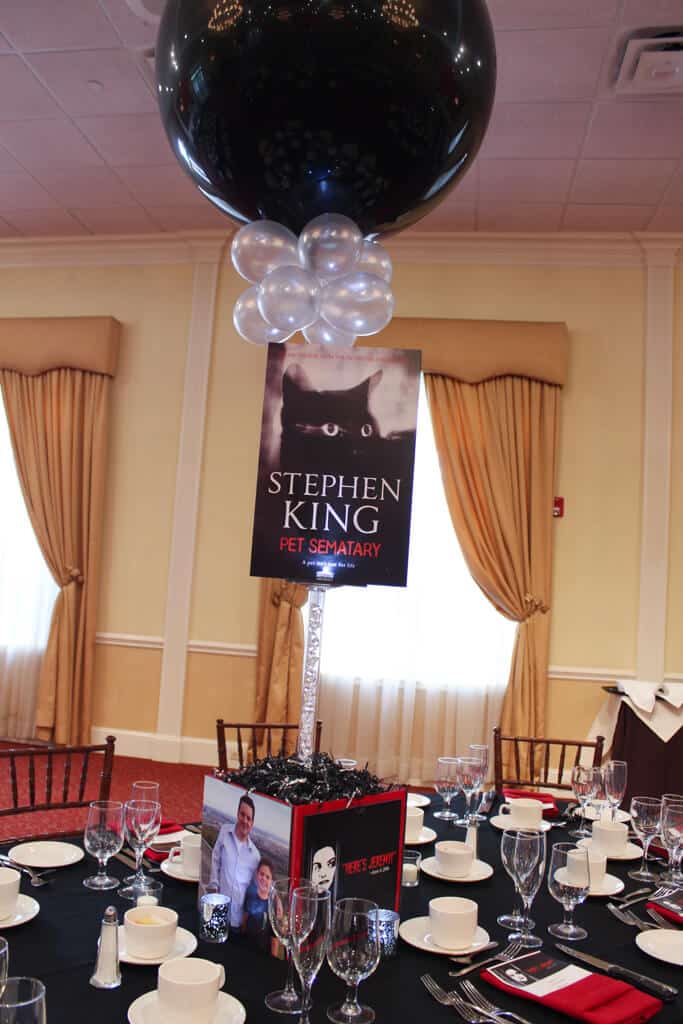 Horror Book Themed Bar Mitzvah Centerpiece with Book Covers and Custom Logo