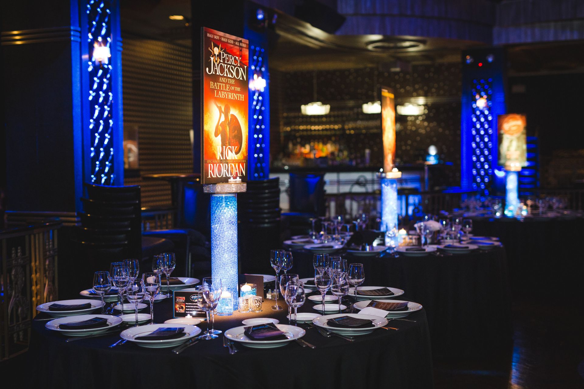 Custom Book Cover Centerpiece on LED Cylinder with Clear Aqua Gems for Book Themed Bar Mitzvah