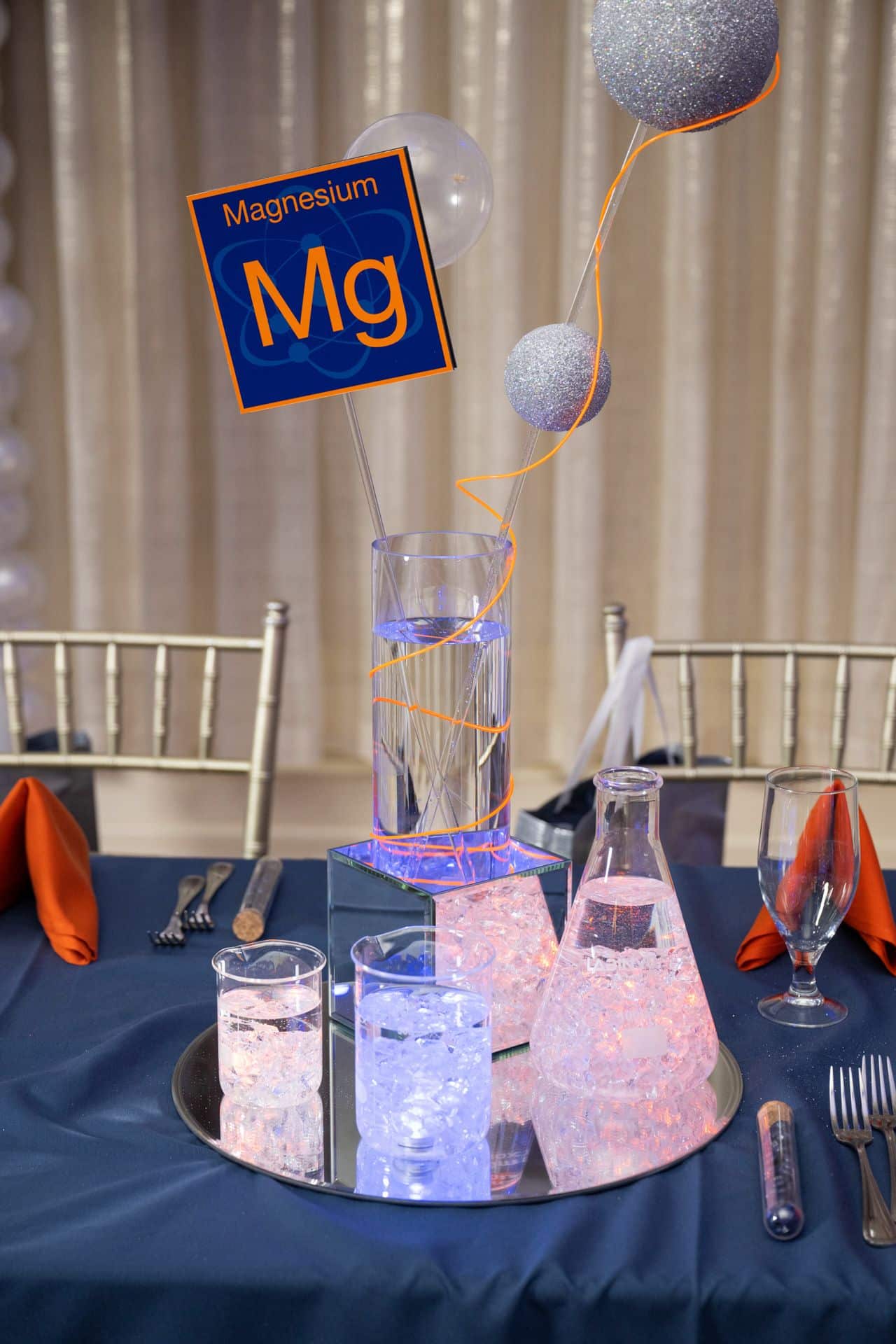 Science Themed Centerpiece with Flasks, Beakers, and an Element Sign