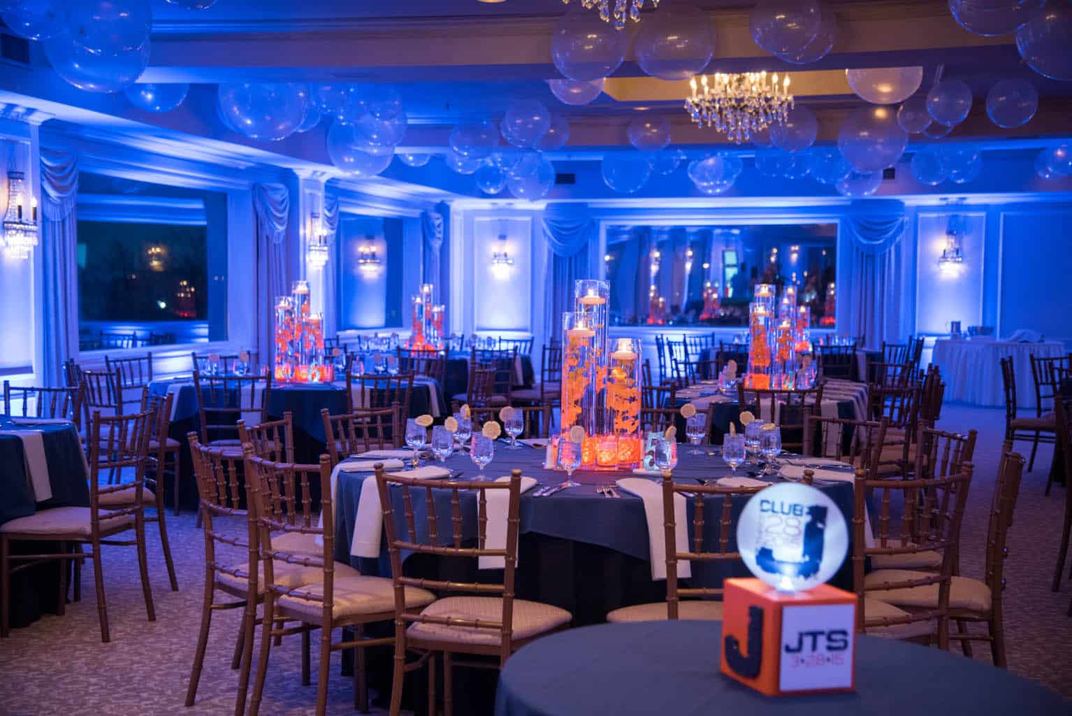 Club Themed Bar Mitzvah with Blue LED Uplighting and Orange Orchid Centerpieces