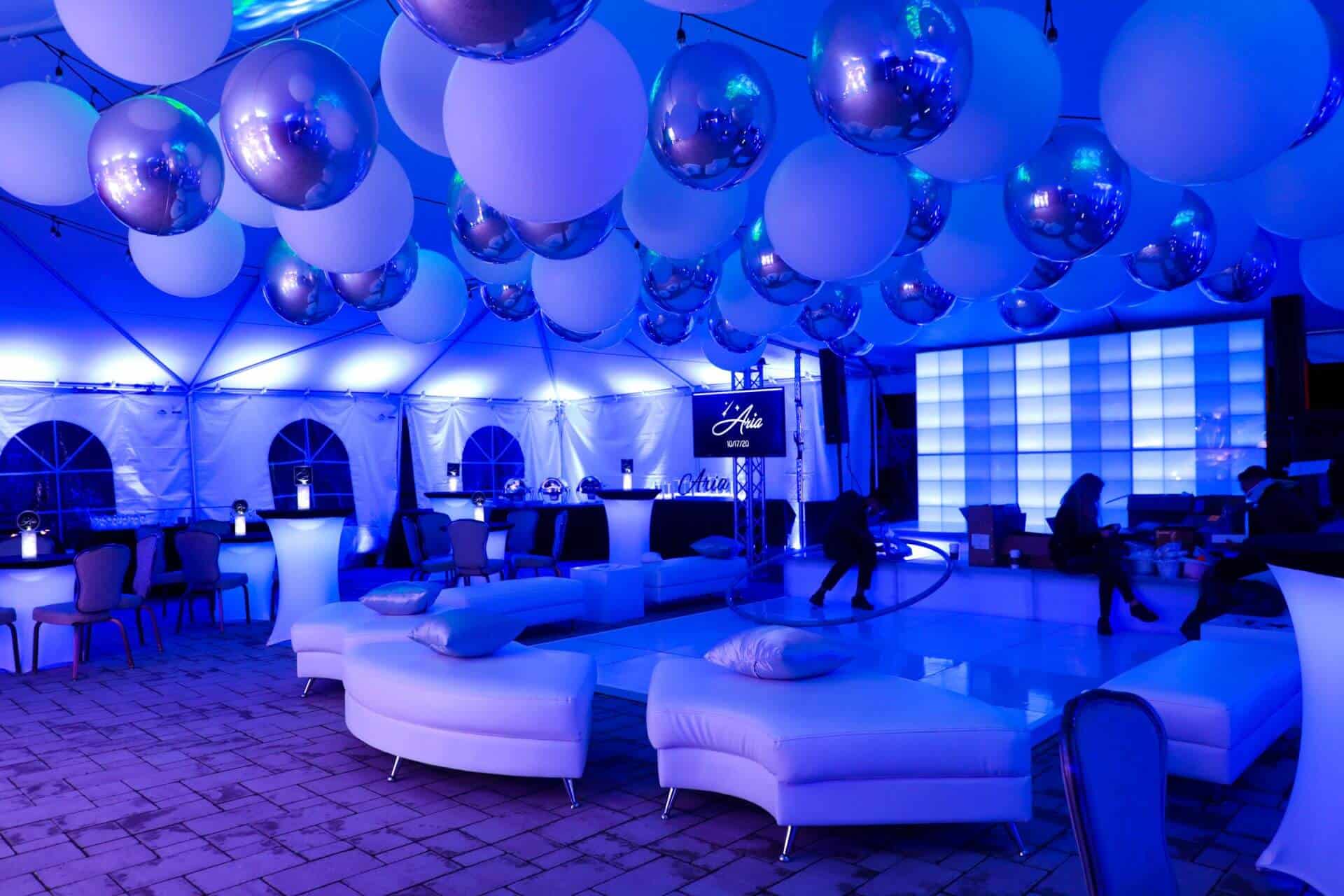 Blue LED Uplighting with White and Silver Ceiling Balloons and Custom Lounge Setup for Bat Mitzvah at Falco's Catering