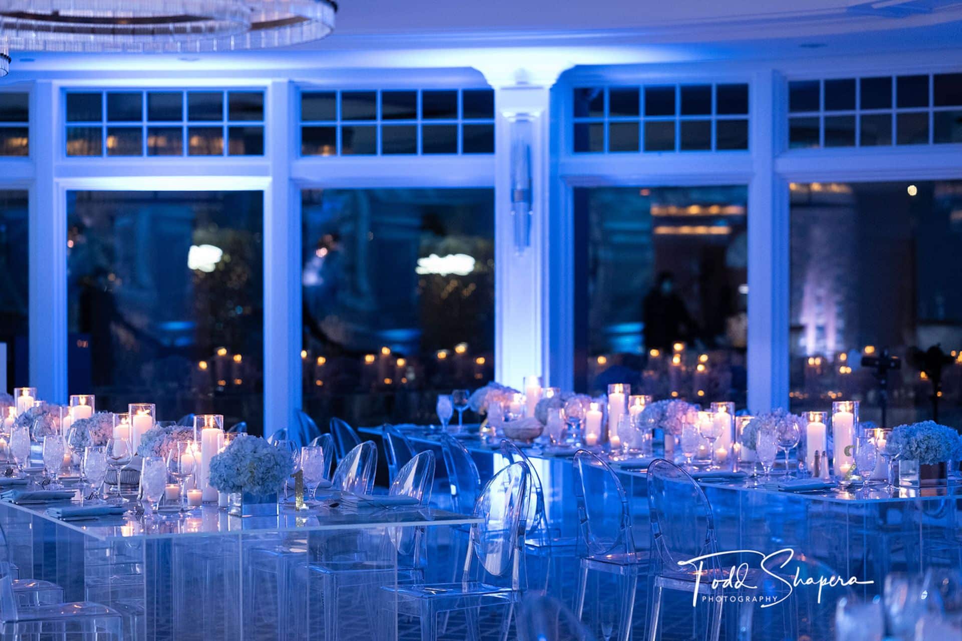 Blue Uplighting with Floral and Candle Centerpieces at Scarsdale Golf Club