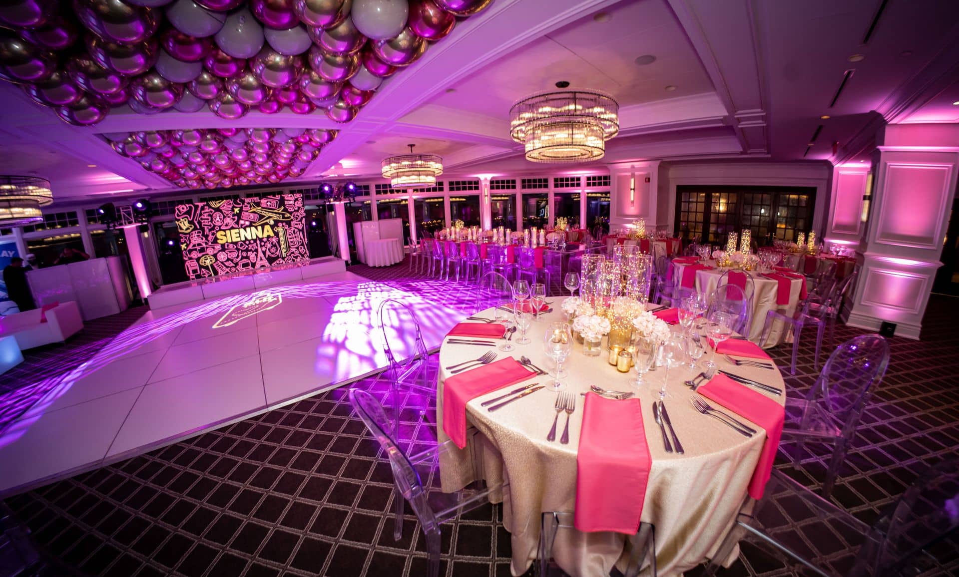 Pink Uplighting with Fairy Light Centerpieces for a Travel Theme Bat Mitzvah at Scarsdale Golf Club