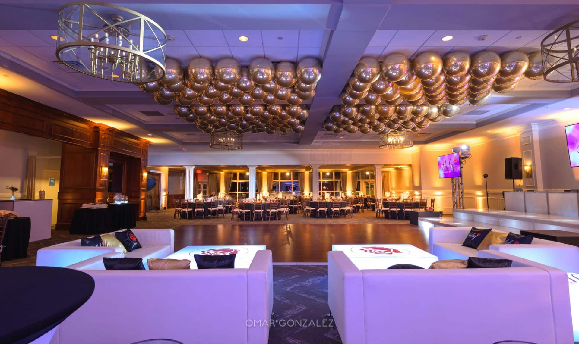 Gold Uplighting with Metallic Orbz Ceiling Treatment and LED Lounge Setup at Paramount Country Club