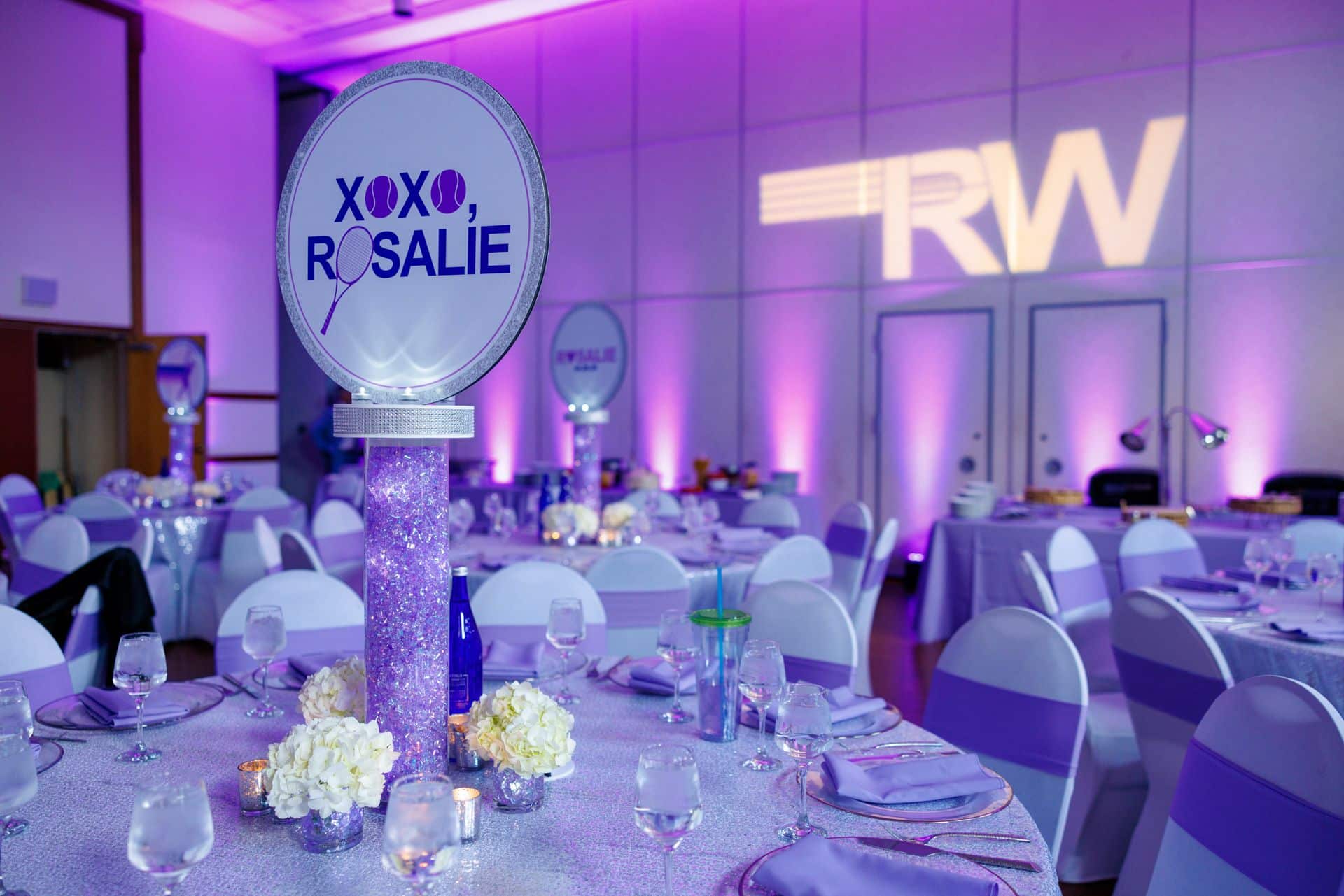 Purple Uplighting with LED Logo Centerpieces for Bat Mitzvah at Temple Israel Center