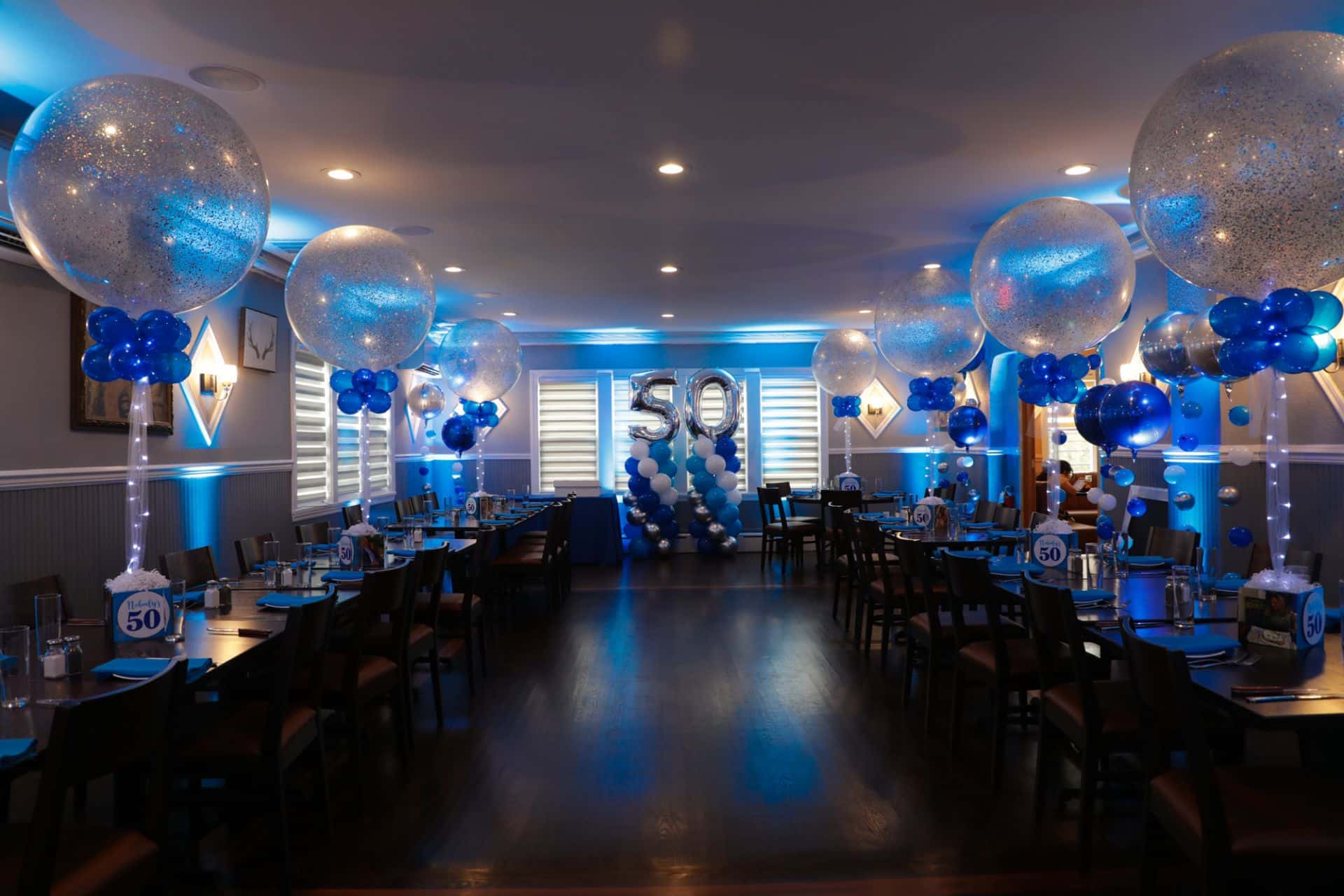 Blue LED Uplighting with Sparkle Balloon Centerpieces and Balloon Columns with Numbers for 50th Birthday at El Toro, Congers